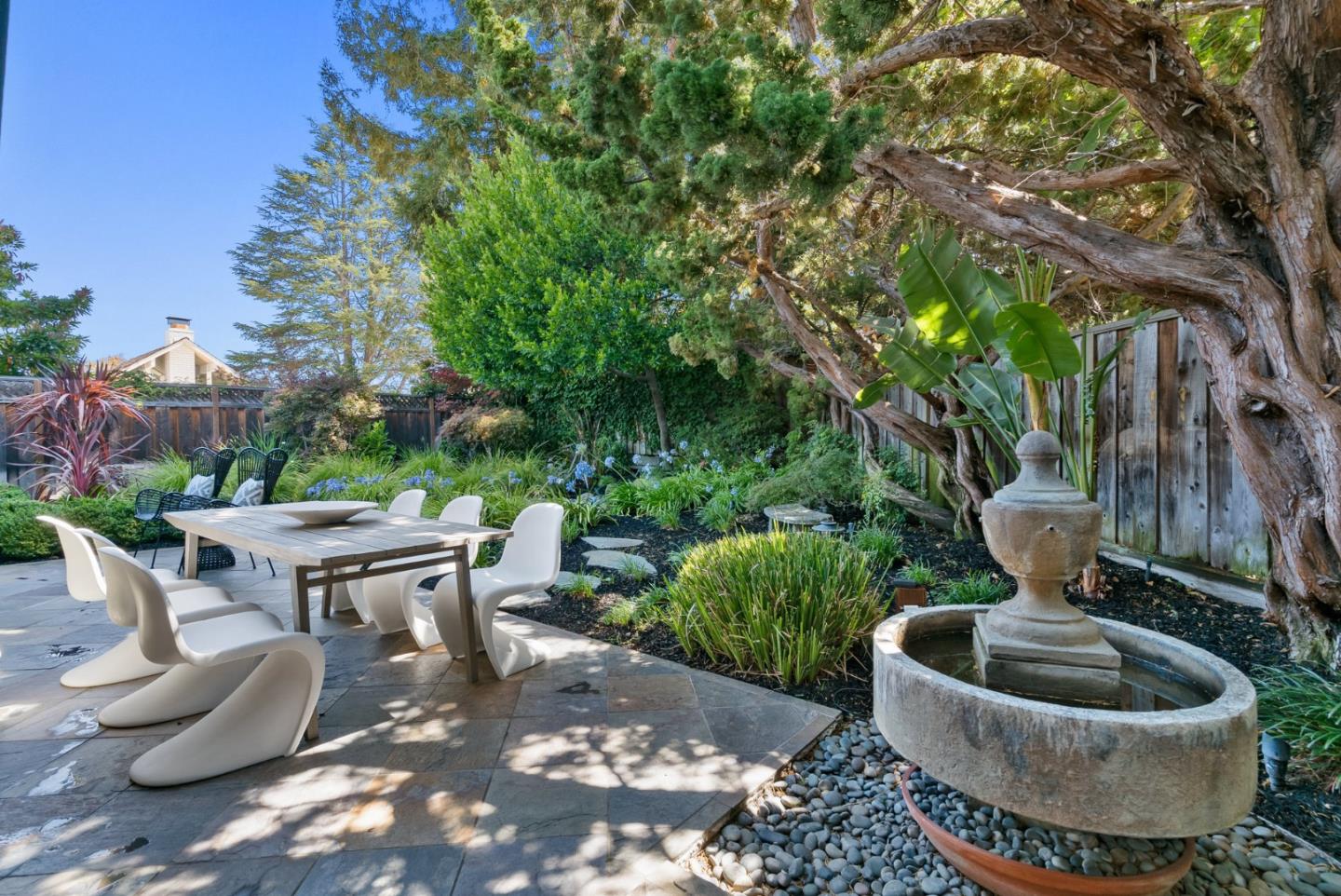 958 Eichler Drive Mountain View, CA 94040 - Photo 50 of 62 a backyard of a house with fire pit and outdoor seating