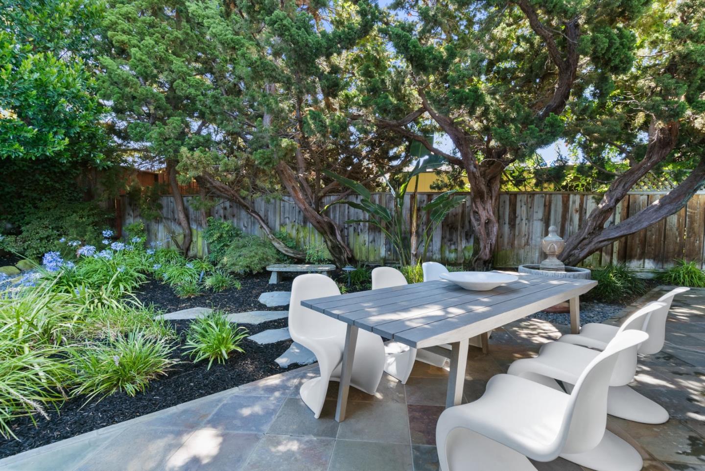 958 Eichler Drive Mountain View, CA 94040 - Photo 51 of 62 a view of a dinning table and chairs in the patio