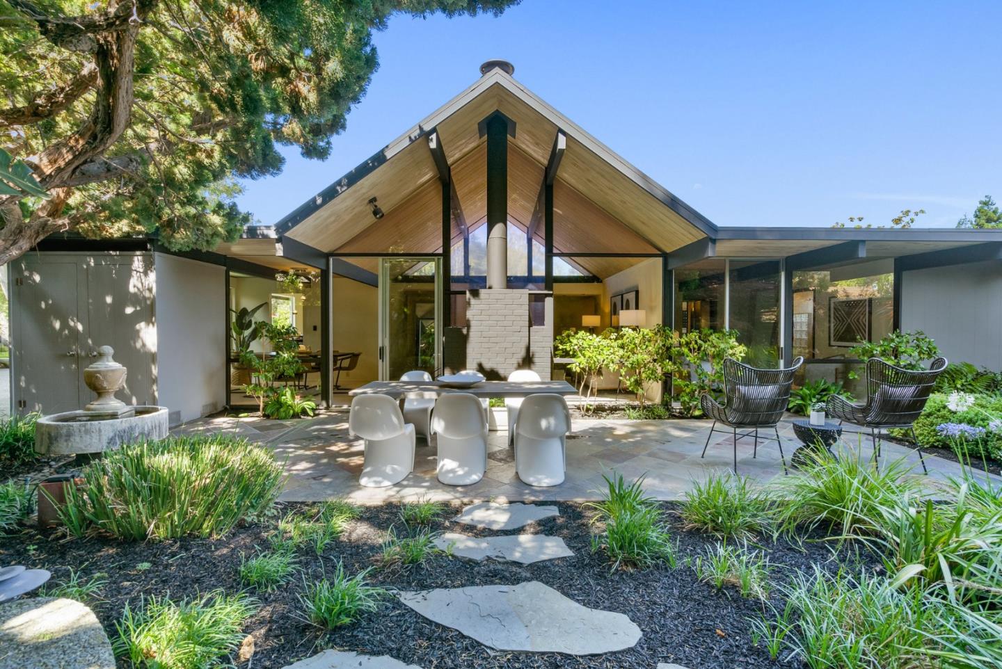 958 Eichler Drive Mountain View, CA 94040 - Photo 55 of 62 a view of a house with yard and sitting area