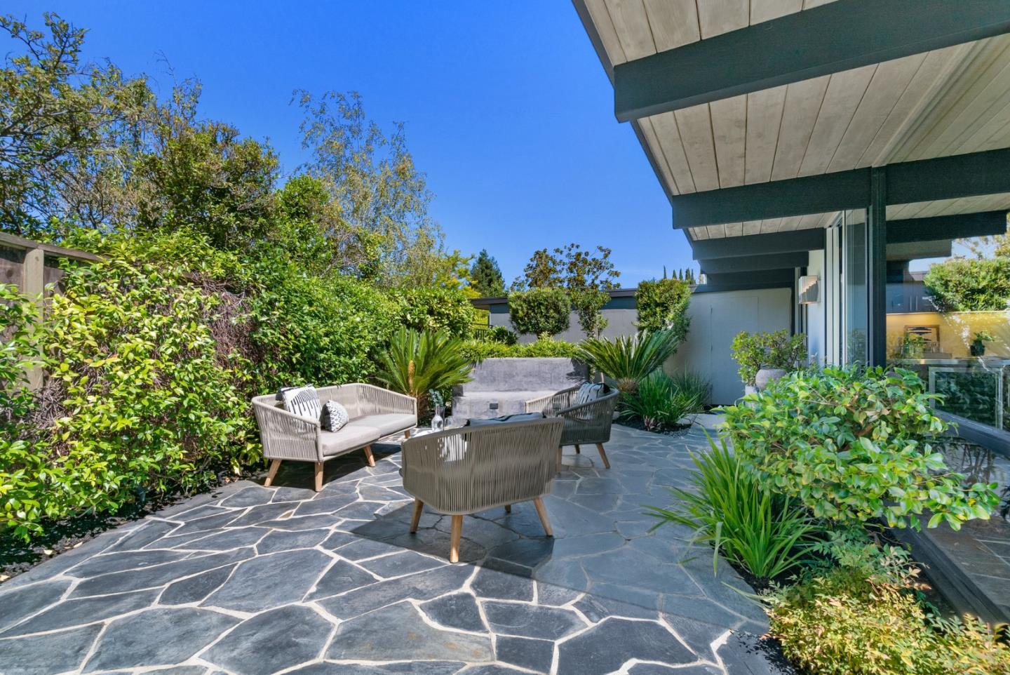 958 Eichler Drive Mountain View, CA 94040 - Photo 57 of 62 a view of a patio with chairs and potted plants