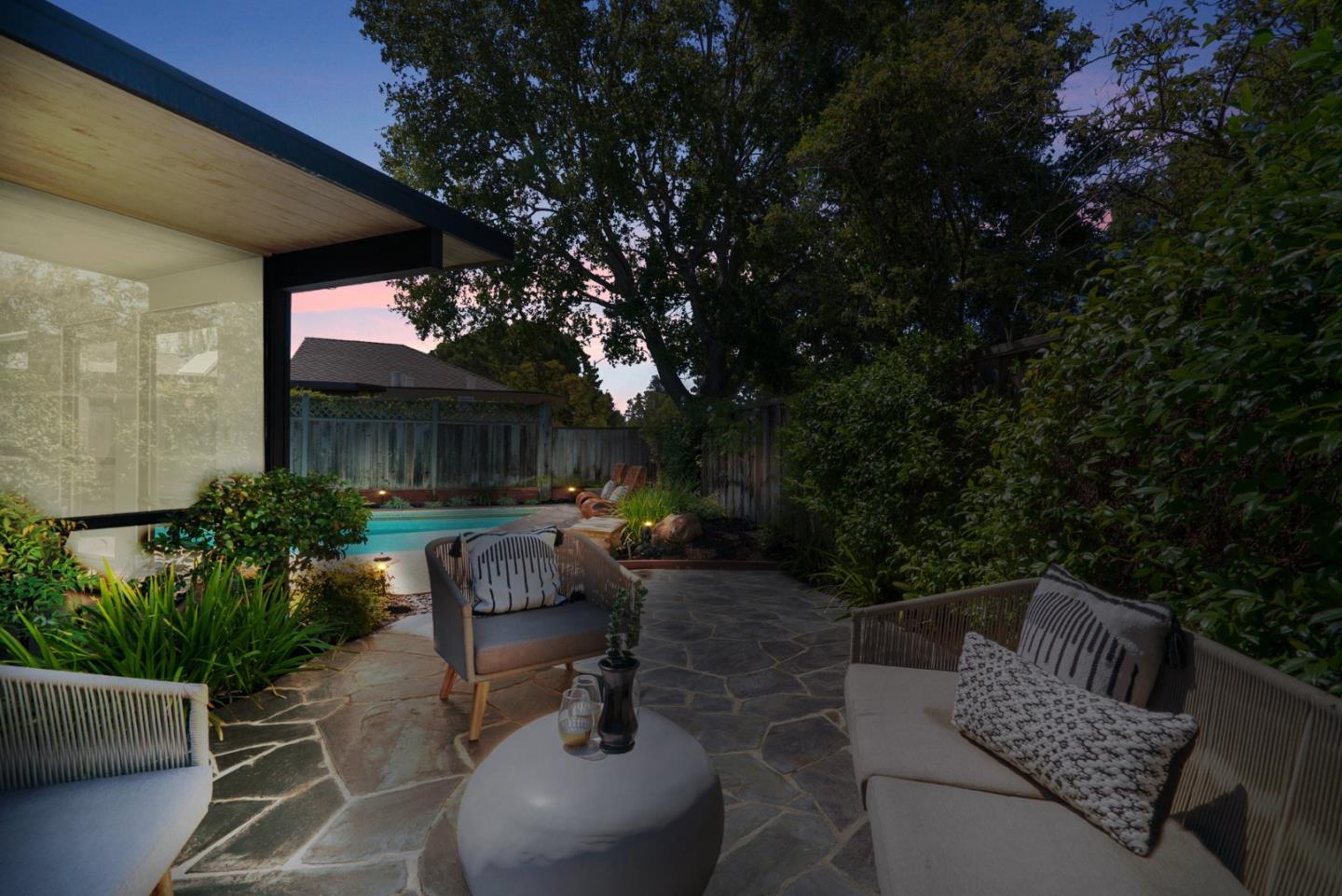 958 Eichler Drive Mountain View, CA 94040 - Photo 7 of 62 a view of a patio with couches table and chairs and potted plants