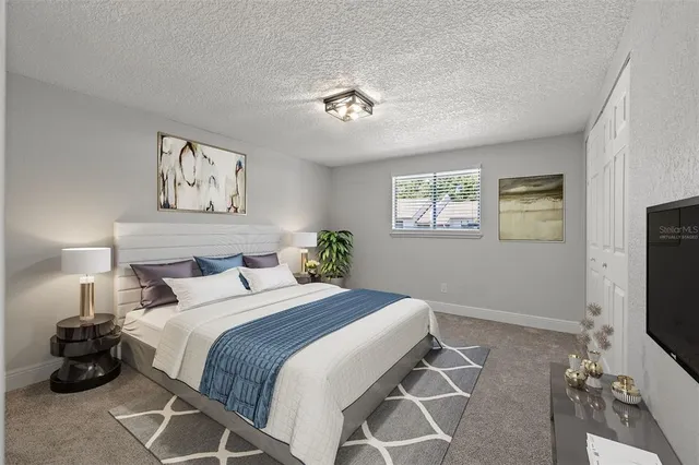 an empty room with windows and ceiling fan view