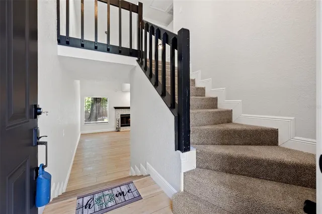 a living room with furniture and a rug