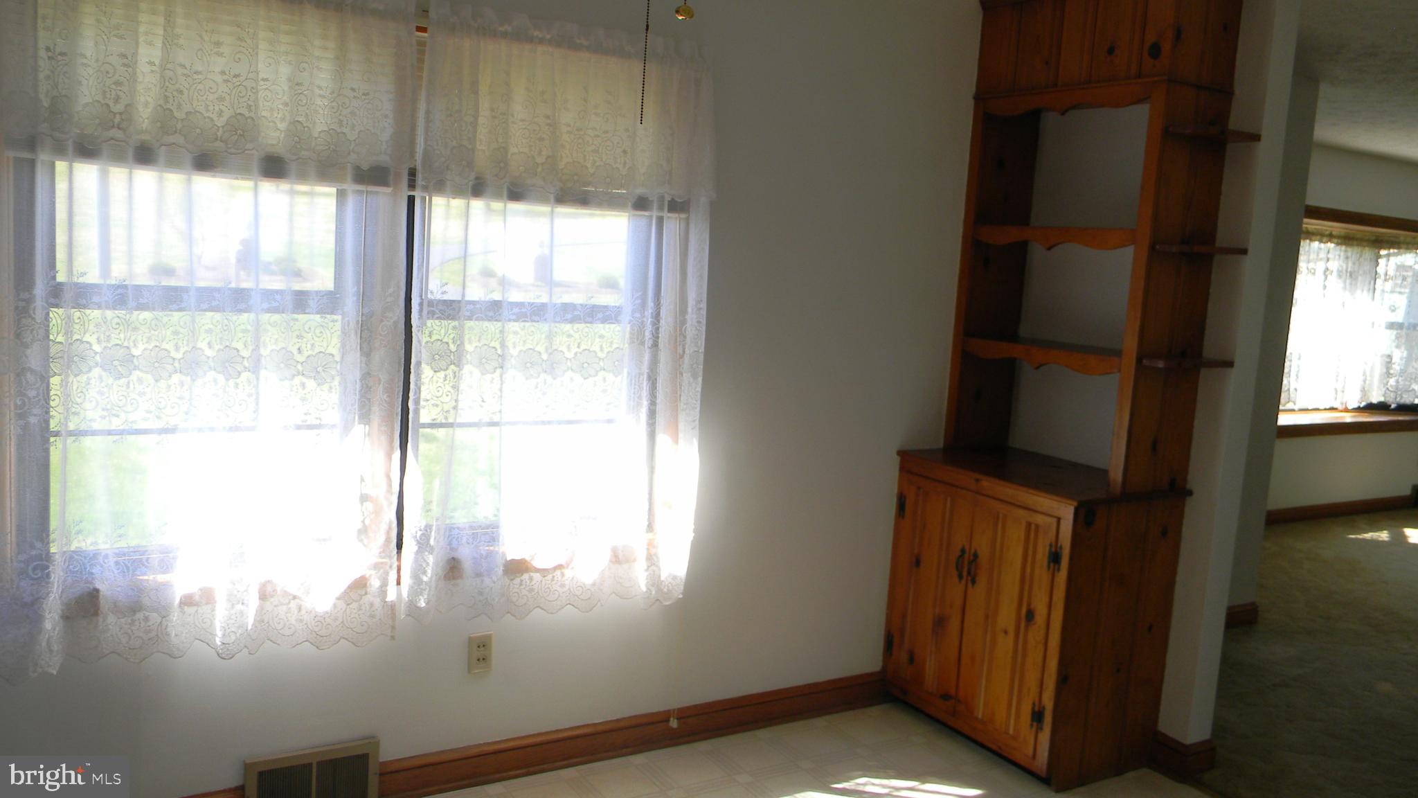 6688 Brocks Gap Road Broadway, VA 22815 - Photo 42 of 81 a view of empty room with wooden floor and fan