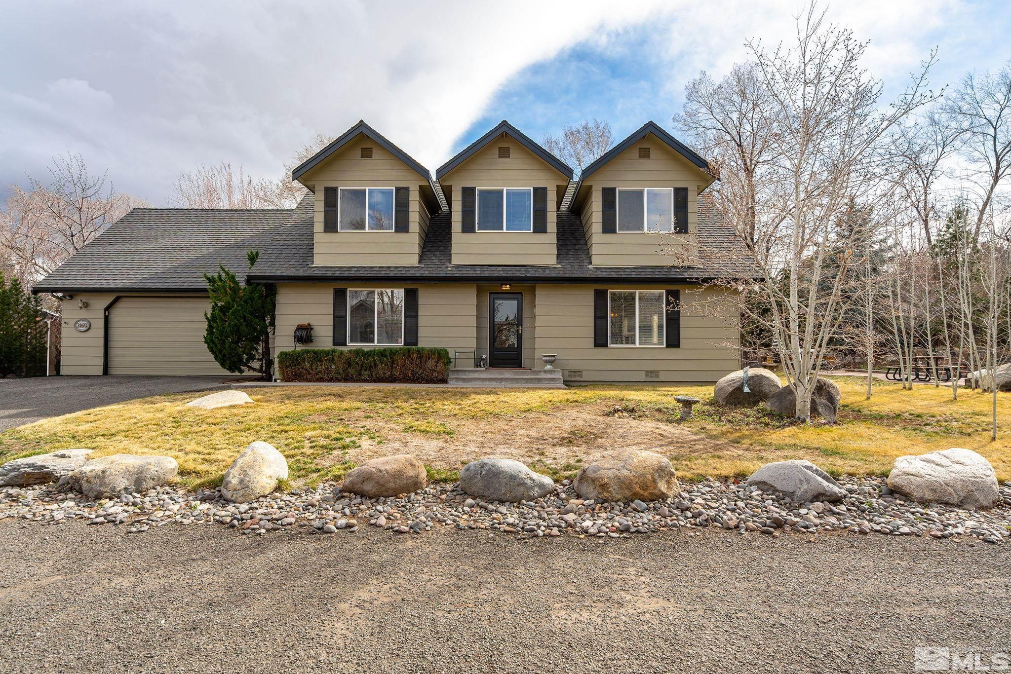 a front view of a house with swimming pool