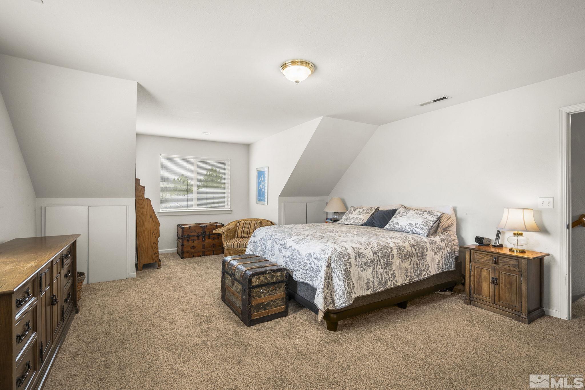 3160 Knight Road Reno, NV 89509 - Photo 16 of 39 a spacious bedroom with a bed and a window