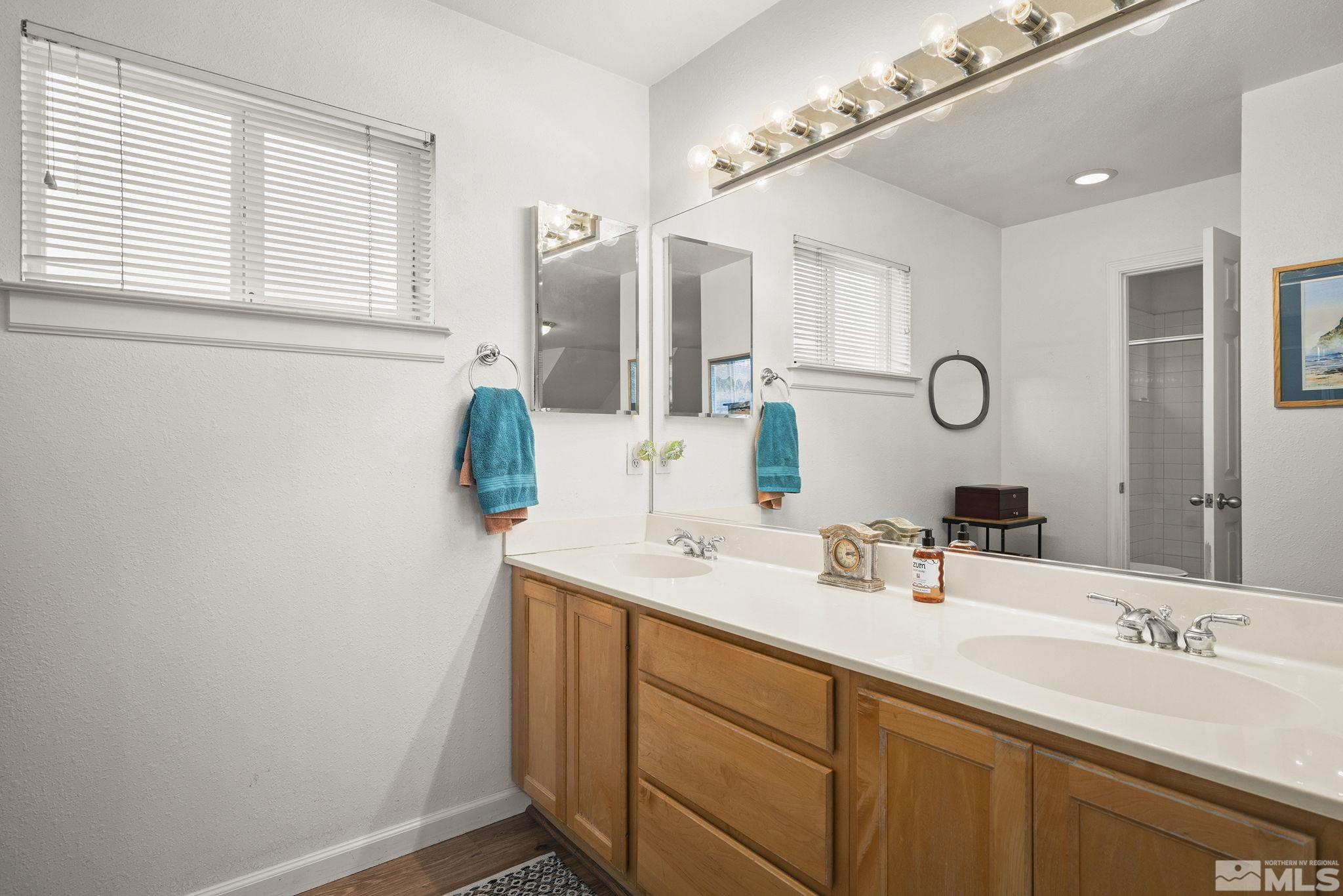 3160 Knight Road Reno, NV 89509 - Photo 17 of 39 a bathroom with a sink and a mirror