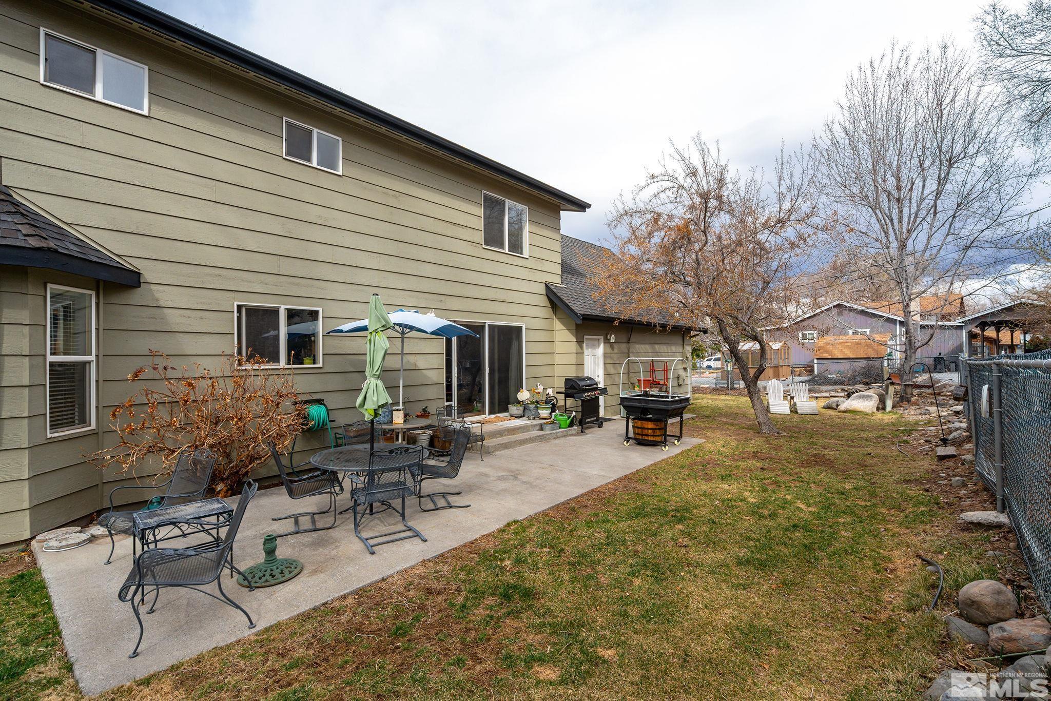 3160 Knight Road Reno, NV 89509 - Photo 23 of 39 a view of a patio with table and chairs and potted plants