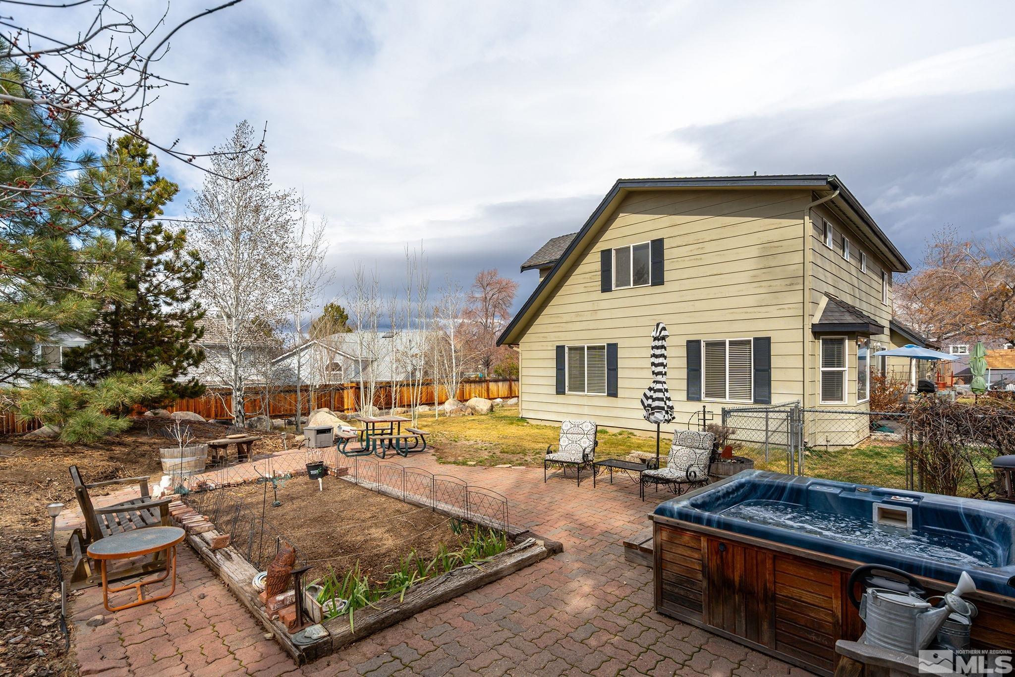 3160 Knight Road Reno, NV 89509 - Photo 25 of 39 a backyard of a house with barbeque oven table and chairs