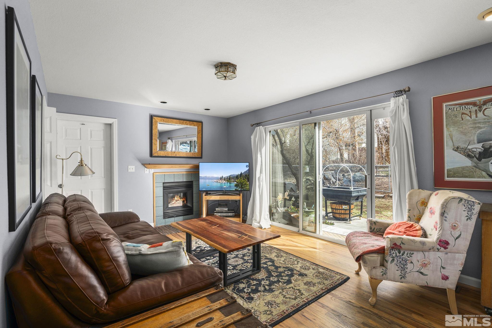 3160 Knight Road Reno, NV 89509 - Photo 10 of 39 a living room with furniture a flat screen tv and a large window