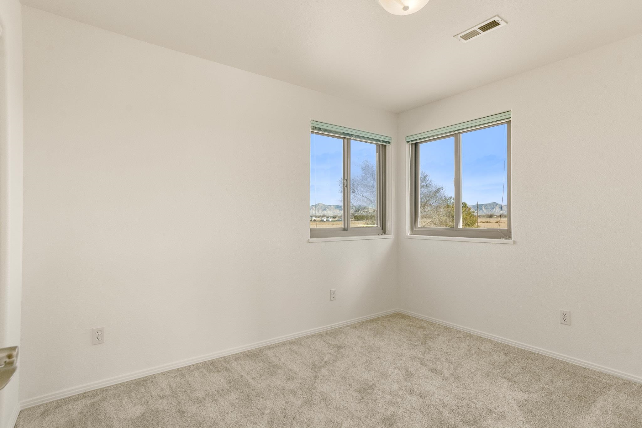 2107 I I- 1/2 Road Grand Junction, CO 81505 - Photo 23 of 42 a view of an empty room with a window