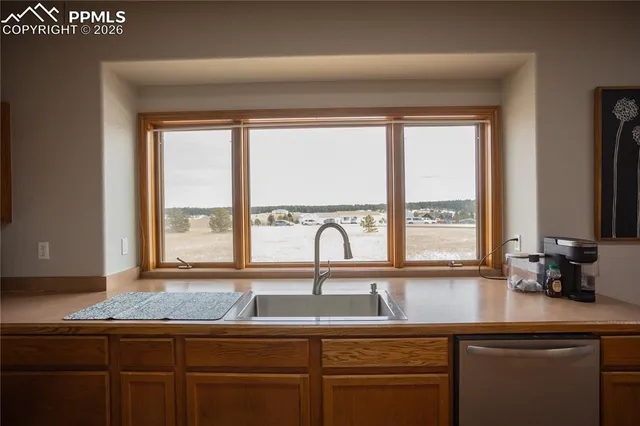 a view of a sink and a window