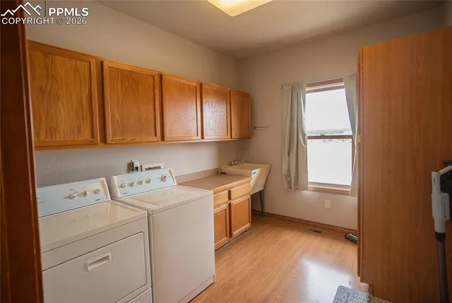 a view of a storage & utility room with a window