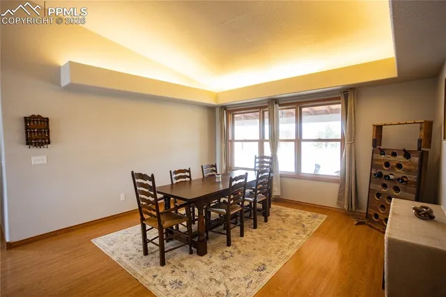 a dining room with furniture and window