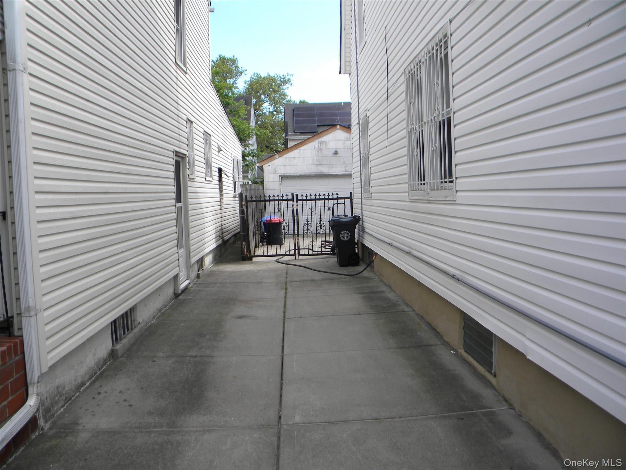241-26 86th Road Queens, NY 11426 - Photo 3 of 38 a view of a back side of house
