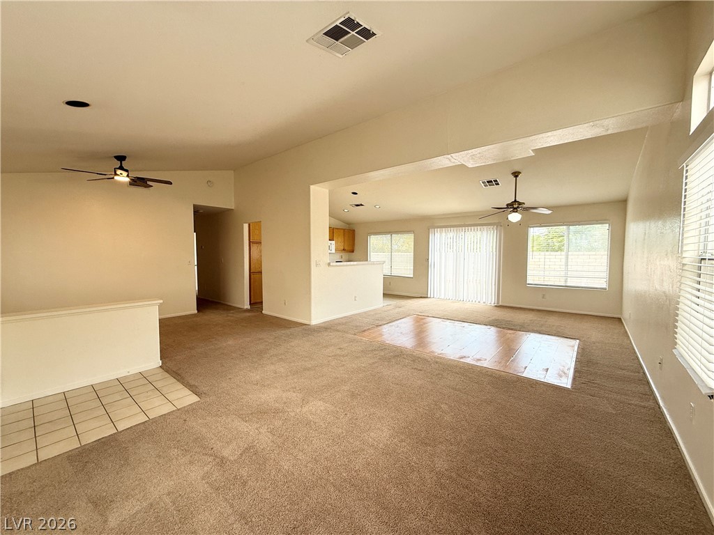 8870 Haviland Road Las Vegas, NV 89123 - Photo 3 of 24 A spacious common area with soaring ceilings and abundant natural illumination from multiple windows.