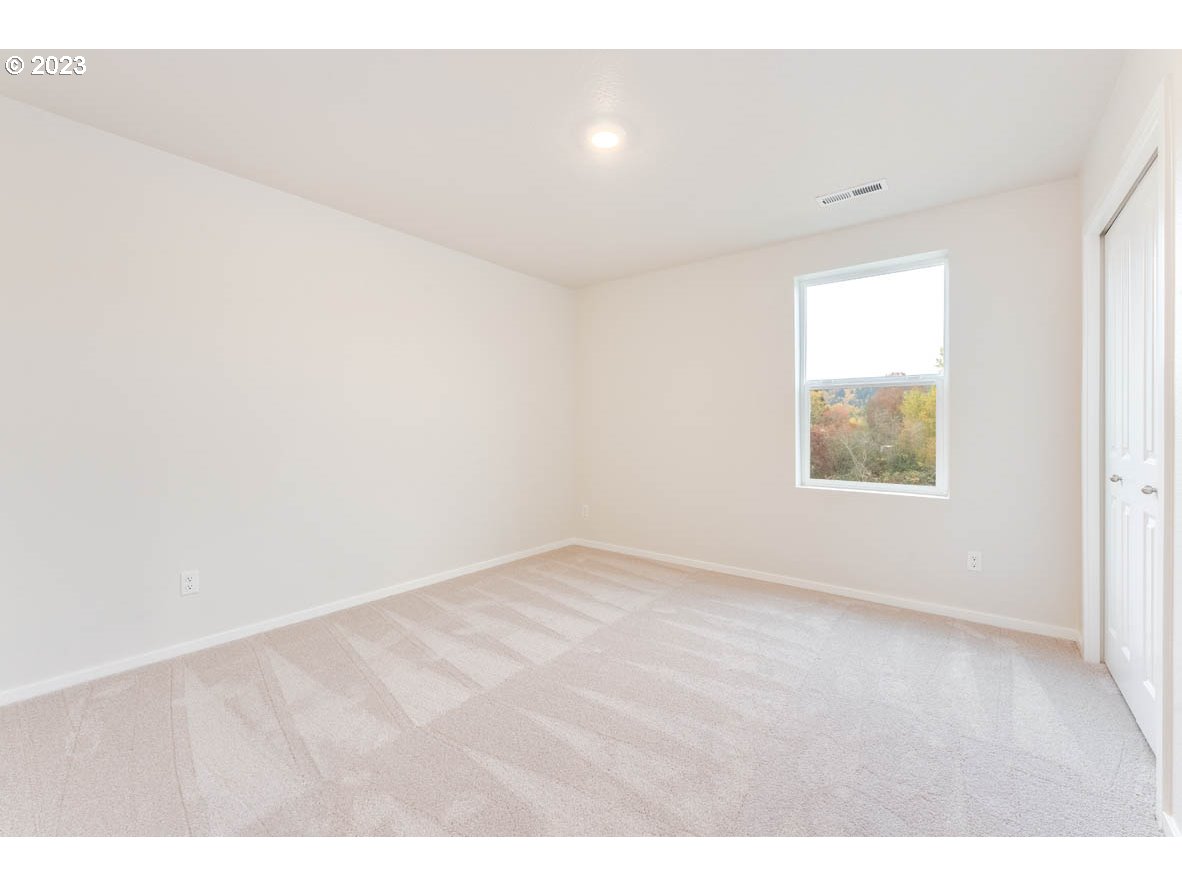 5629 Earth Street Northeast Dallas, OR 97338 - Photo 18 of 35 a view of an empty room with a window