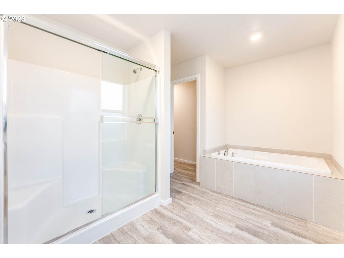 5629 Earth Street Northeast Dallas, OR 97338 - Photo 25 of 35 a bathroom with a shower and a glass door