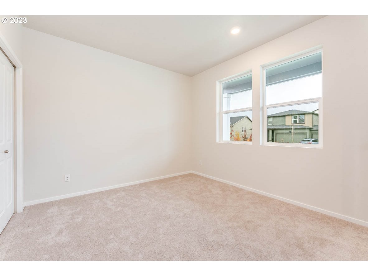 5629 Earth Street Northeast Dallas, OR 97338 - Photo 5 of 35 an empty room with a window
