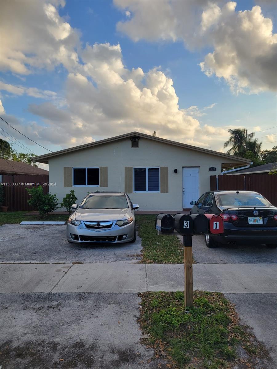 a car parked in front of a house