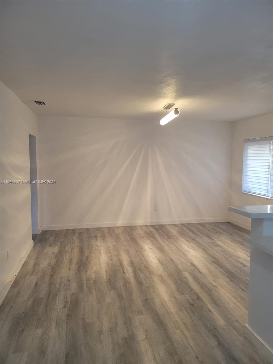 5922 Pierce Street, Unit 1 Hollywood, FL 33021 - Photo 4 of 7 a view of an empty room