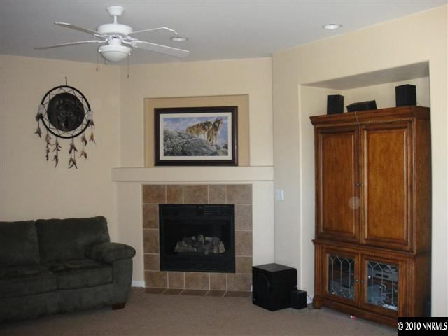 10593 Blockade Drive Reno, NV 89521 - Photo 3 of 9 a living room with furniture and a fireplace