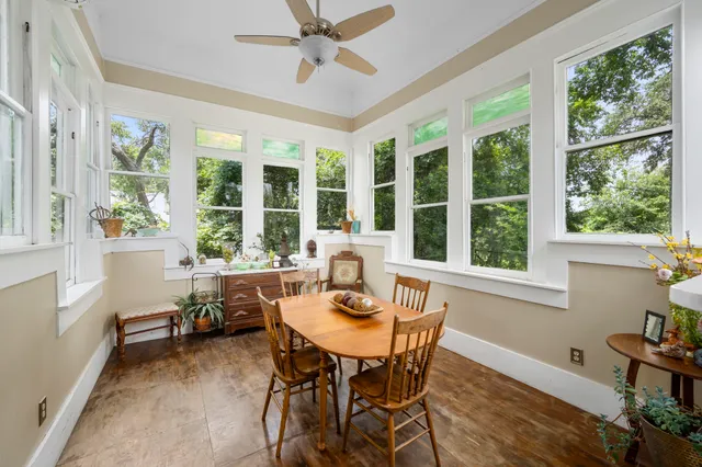 a view of a dining room with furniture window and outside view