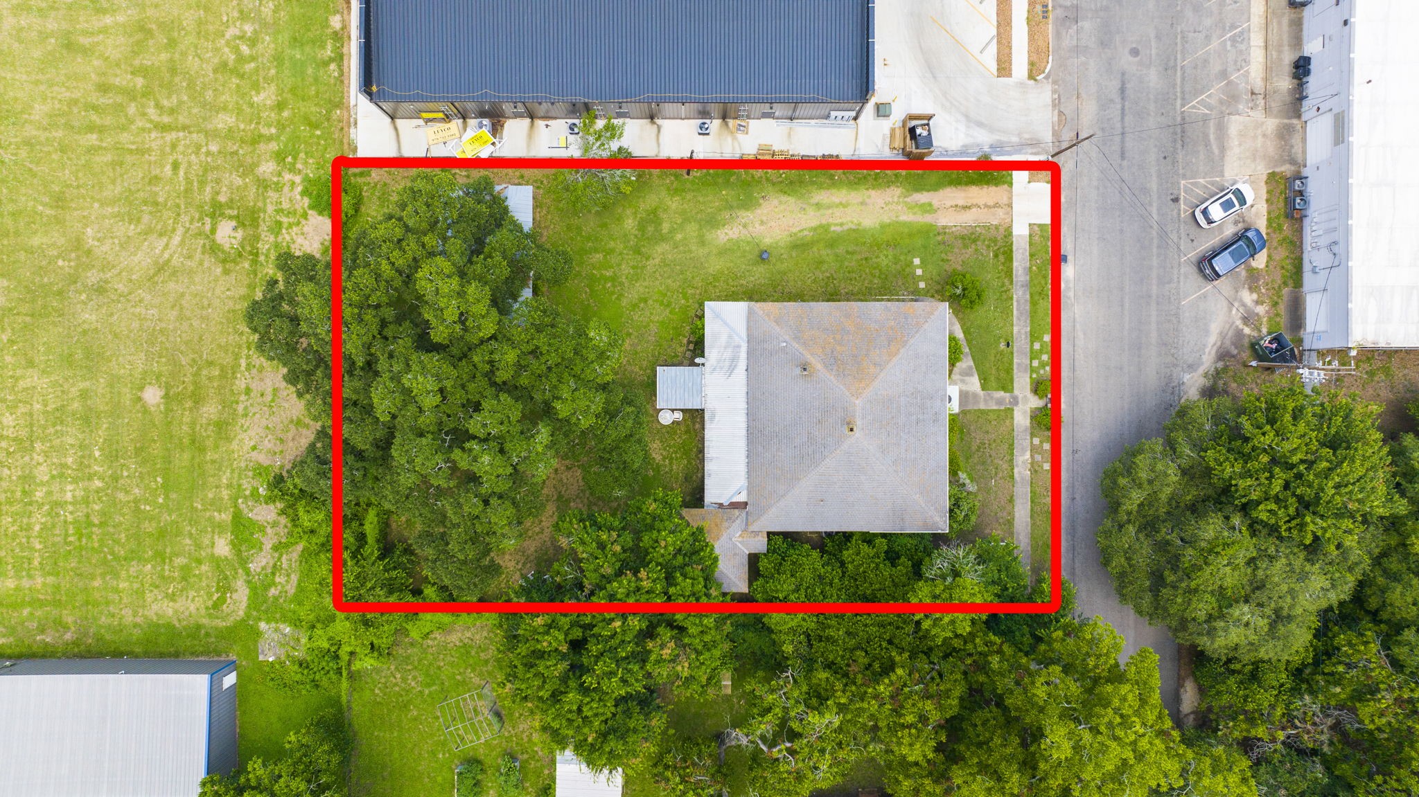 1118 Prairie Street Columbus, TX 78934 - Photo 29 of 34 a view of a flower garden with a building in the background