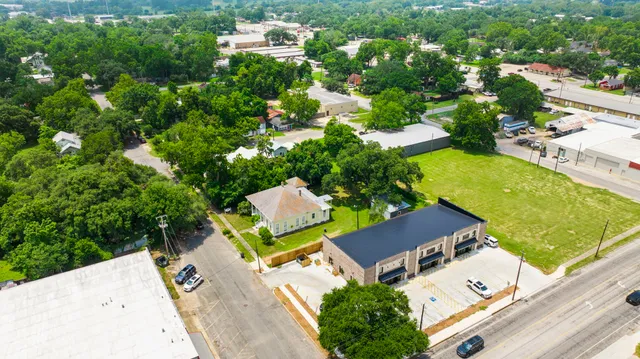 an aerial view of house with yard