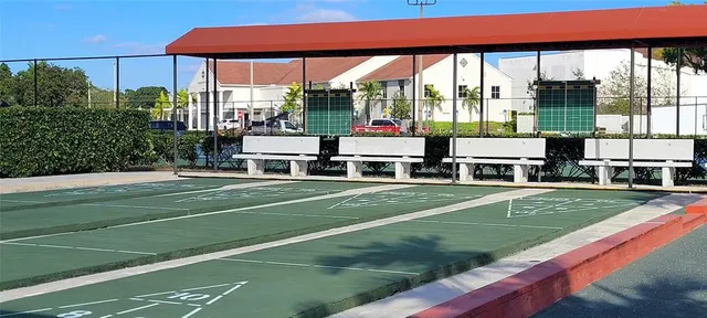 a front view of a multi story building with yard