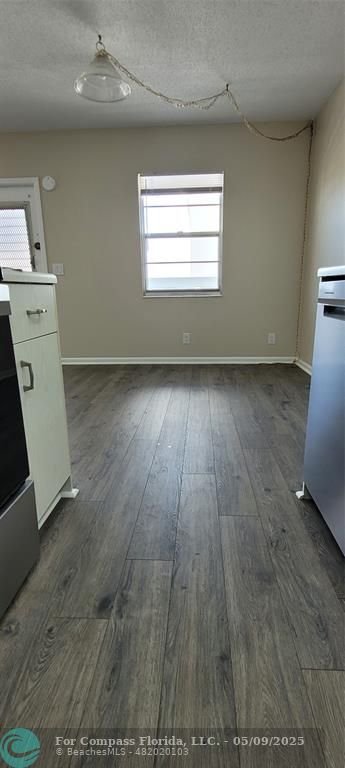 4070 Exeter Boca Raton, FL 33434 - Photo 42 of 59 an empty room with wooden floor and windows