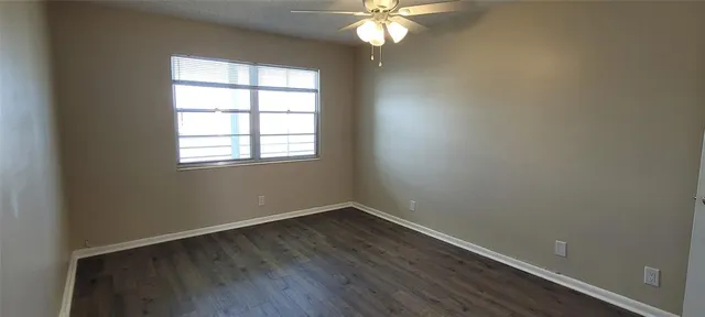 a view of room with wooden floor