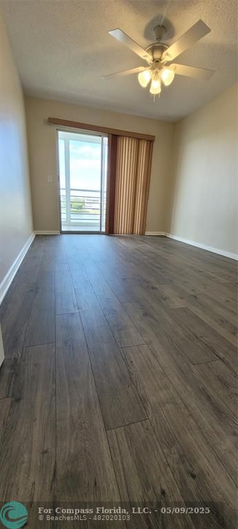 4070 Exeter Boca Raton, FL 33434 - Photo 51 of 59 wooden floor in an empty room with a window