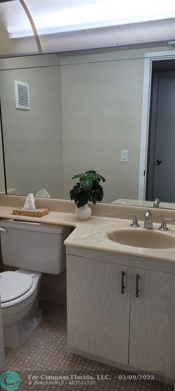 4070 Exeter Boca Raton, FL 33434 - Photo 55 of 59 a bathroom with a sink toilet and mirror