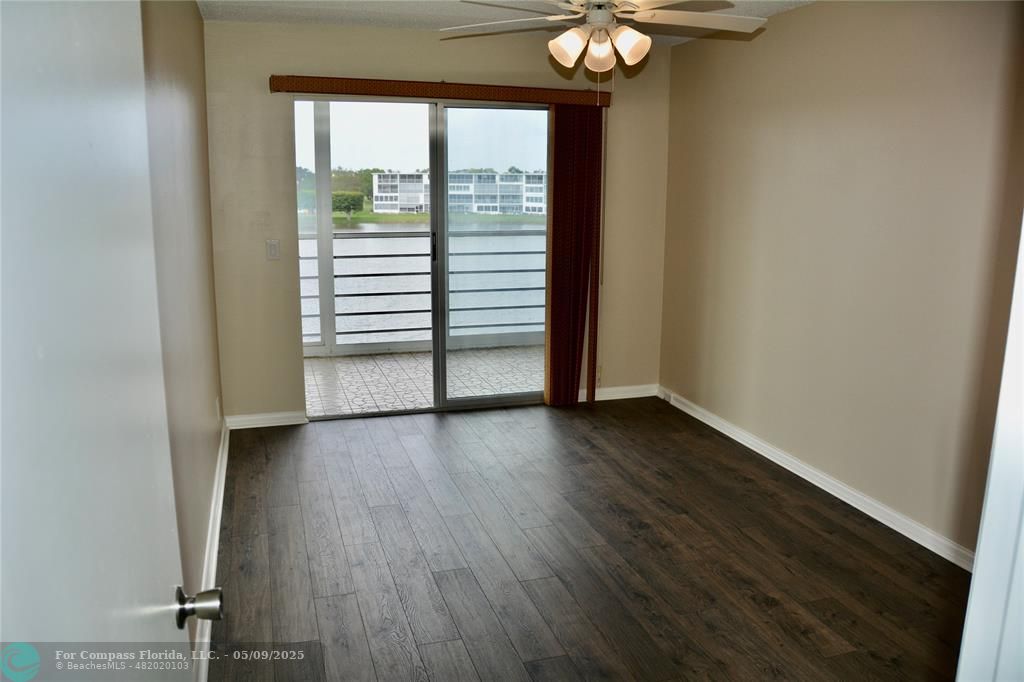 4070 Exeter Boca Raton, FL 33434 - Photo 8 of 59 a view of a livingroom with wooden floor and a window