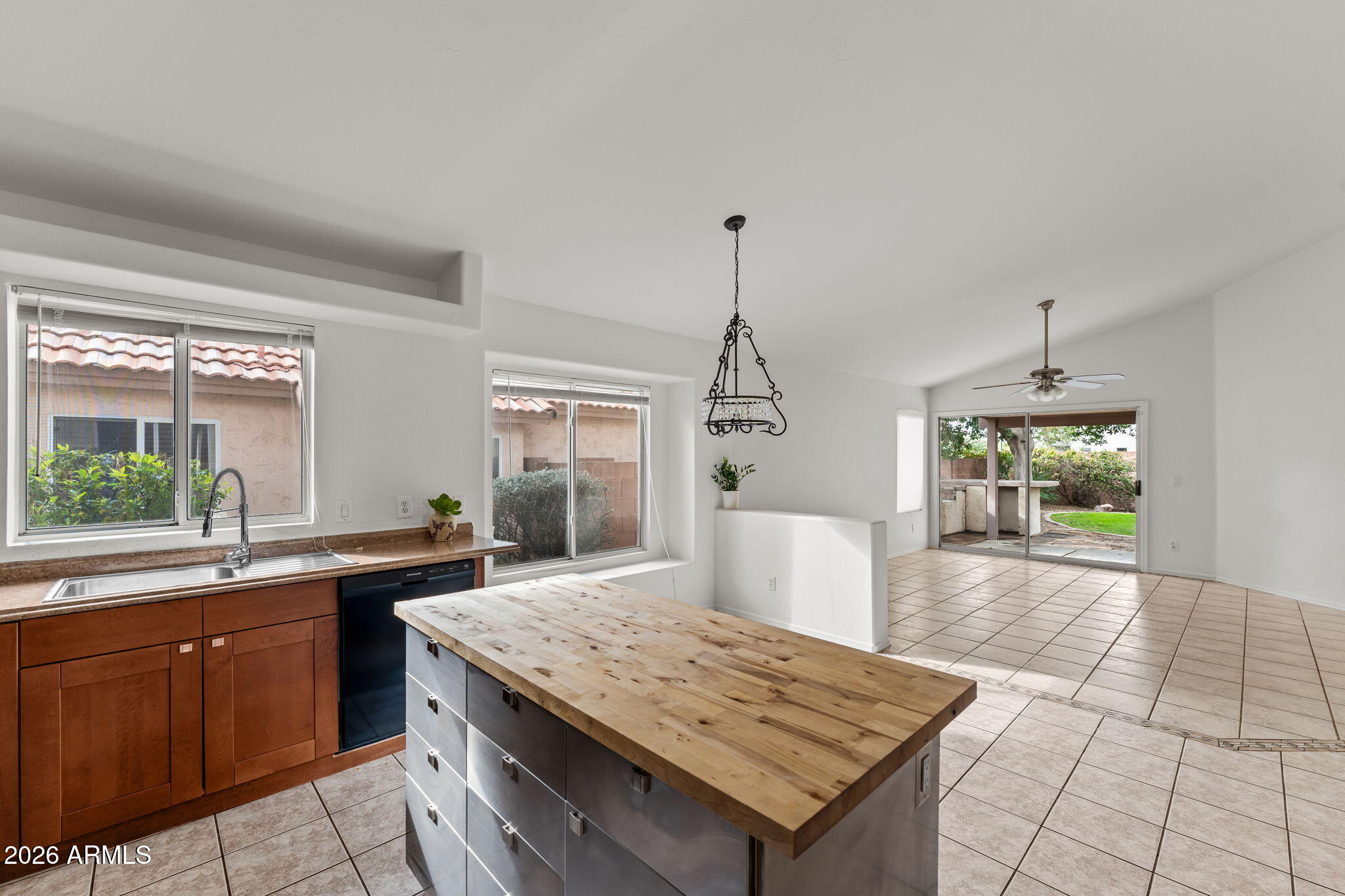 20220 North 9th Street Phoenix, AZ 85024 - Photo 17 of 36 a kitchen with granite countertop a sink and a stove