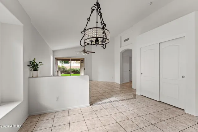 a view of an empty room and a window