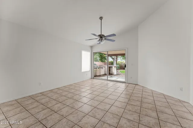 a view of a kitchen with furniture and wooden floor