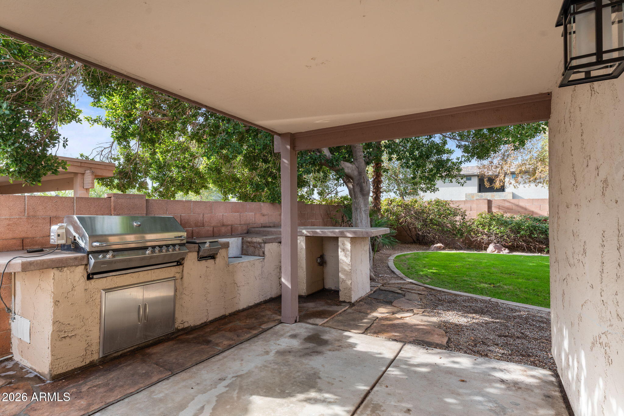 20220 North 9th Street Phoenix, AZ 85024 - Photo 34 of 36 a view of a backyard with plants and outdoor kitchen