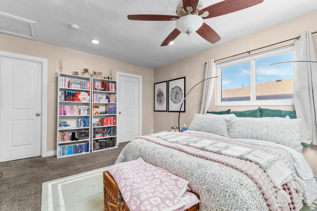 1489 North 400 West Bountiful, UT 84010 - Photo 15 of 47 Bedroom featuring a dual-pane window, ceiling fan with integrated lighting, recessed lighting, and soft neutral wall tones