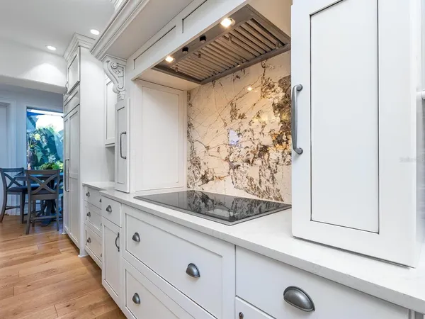 a view of a porch with furniture and floor to ceiling window