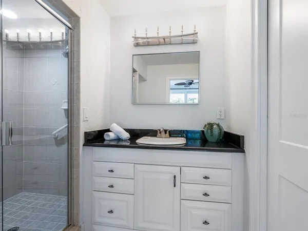 a balcony with table and chairs