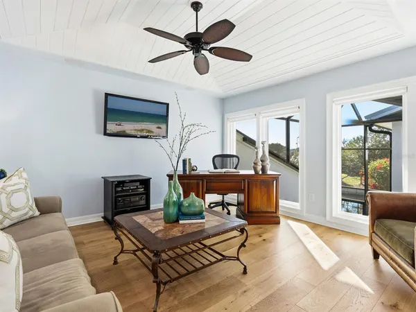 a bed room with a bed and chair