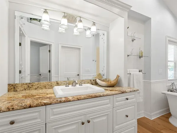 a view of a lake with a house in the background