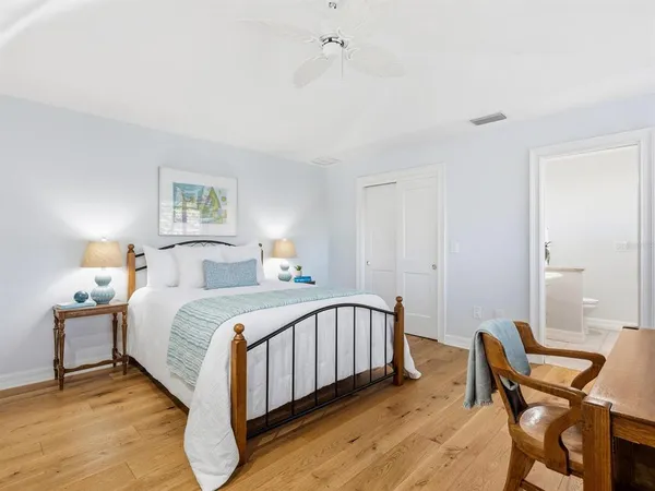 an aerial view of a house with a swimming pool a yard and mountain view in back