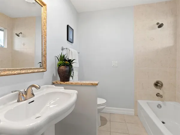 an aerial view of lake and residential houses with outdoor space