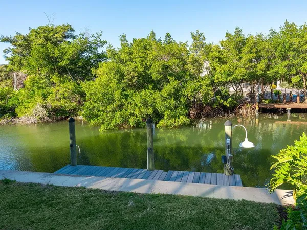 a view of a porch with furniture and yard