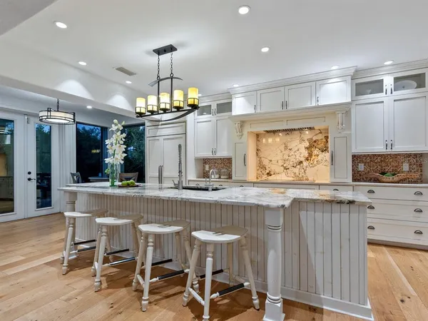 a view of a lake with boats and trees in the background