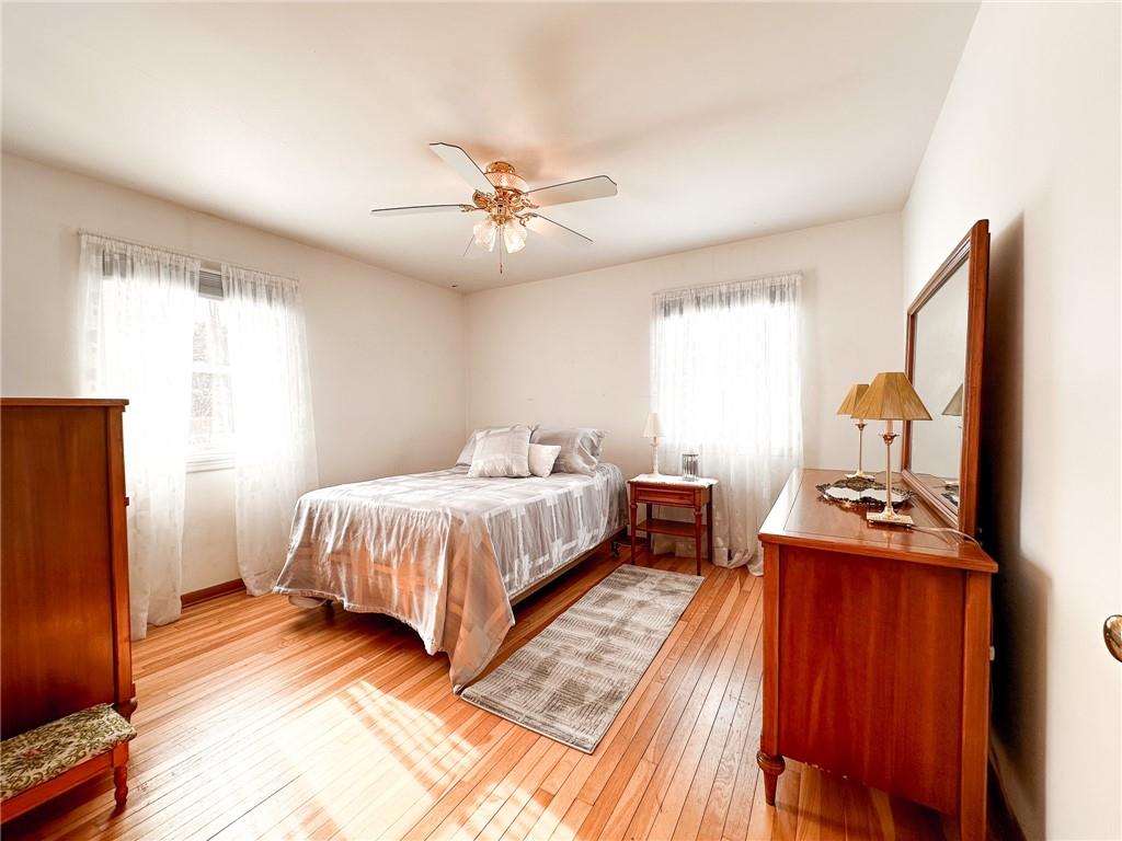 112 Reed Drive Industry, PA 15052 - Photo 12 of 38 a spacious bedroom with a bed and a flat screen tv