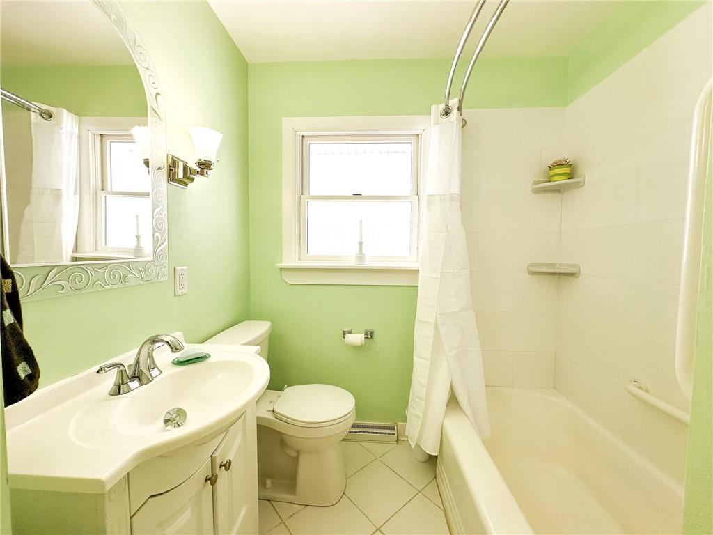 112 Reed Drive Industry, PA 15052 - Photo 14 of 38 a bathroom with a sink mirror toilet and shower